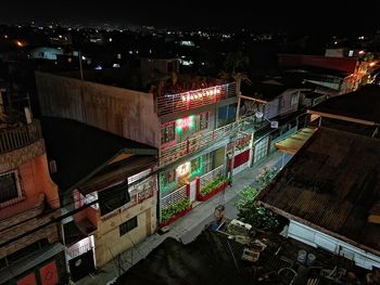 High angle view of illuminated buildings in city at night