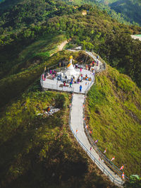 High angle view of people on mountain by trees