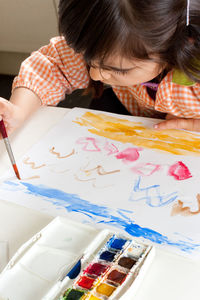 Portrait of cute girl on table