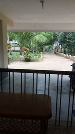 Chairs and table against trees at home