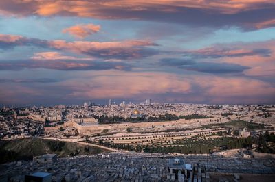 Aerial view of townscape against sky during sunset