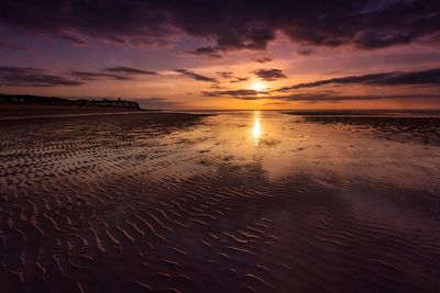 View of beach at sunset