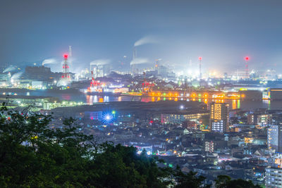 Illuminated buildings in city at night