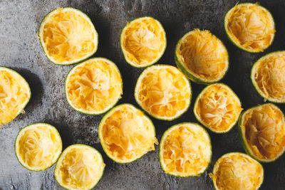 Directly above shot of orange fruits with peel on marble