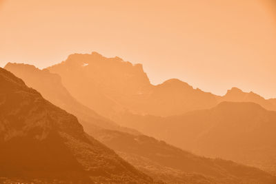 Scenic view of mountains against sky during sunset