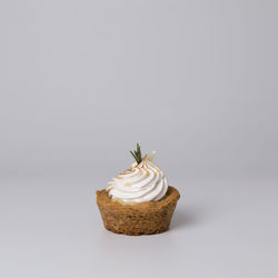 Close-up of cake against white background