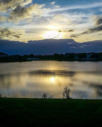 Scenic view of lake at sunset