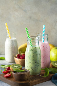 Fruits in glass jar on table