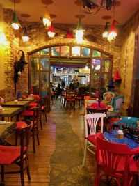 Chairs and tables in cafe at night