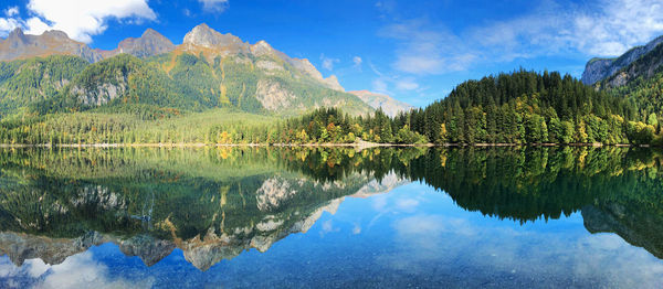 Scenic view of lake and mountains against sky