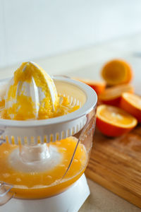 Close-up of orange juice on table