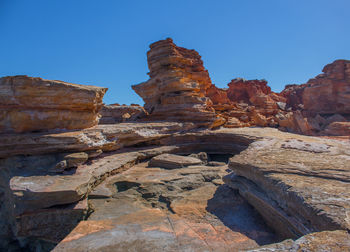 Rock formations against blue sky