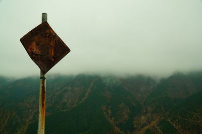 Scenic view of landscape against cloudy sky