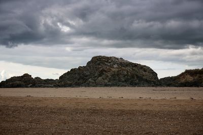 Rock formations on landscape against sky