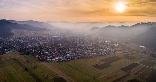 High angle view of cityscape against sky at sunset