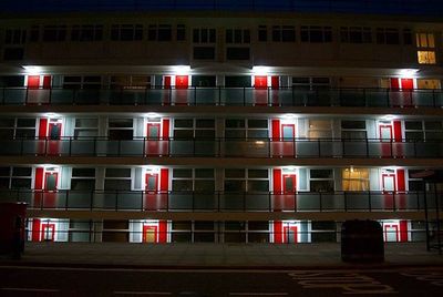 Buildings in city at night