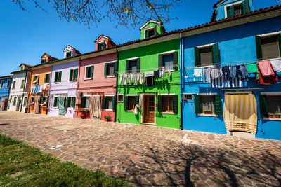 Houses against blue sky in city