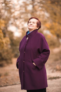 Senior woman standing in park