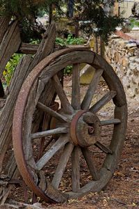 Old rusty wheel on field