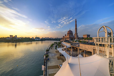 Panoramic view of river against sky at sunset