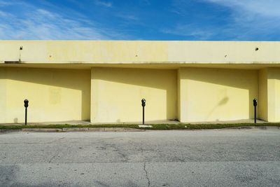 Yellow wall against sky