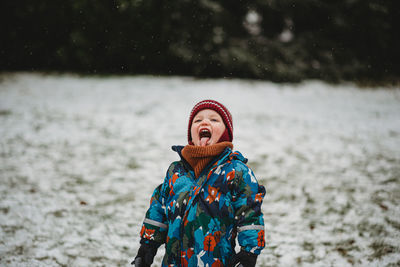 Person standing on snow covered land