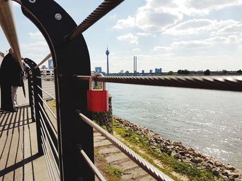 View of bridge over river against cloudy sky