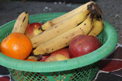 High angle view of fruits in basket on table