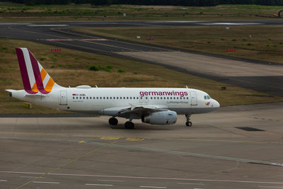 View of airplane at airport runway