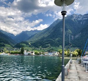 Scenic view of lake and mountains against sky