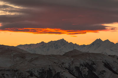 Scenic view of mountains against sky during sunset