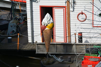 Artificial ice cream cone against doorway