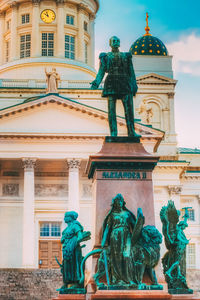 Low angle view of statue against building