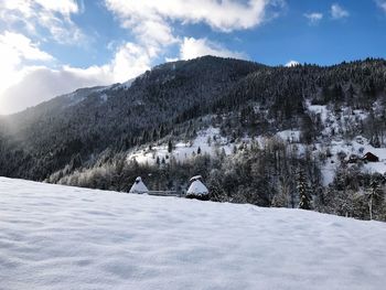 Scenic view of snowcapped mountains against sky