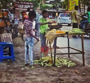 People working at market stall