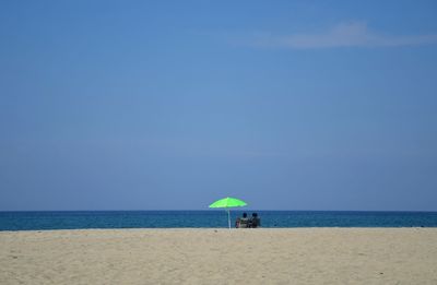 Scenic view of beach against clear sky