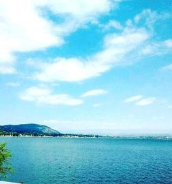 View of calm sea against cloudy sky