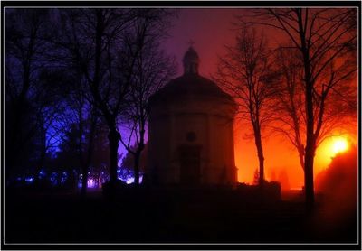 Silhouette of church at night