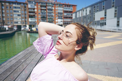Portrait of beautiful woman in city