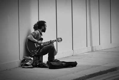 Man sitting on guitar