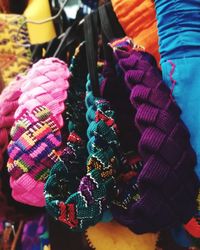 Close-up of multi colored umbrellas hanging at market stall