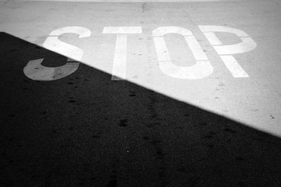 Close-up of stop sign on road