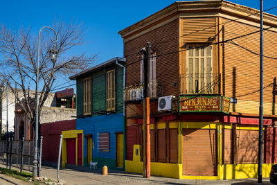 Exterior of building by street against sky