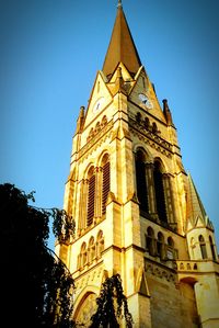 Low angle view of church against clear blue sky