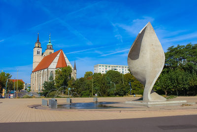 Sculpture of building against blue sky