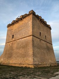 Low angle view of historic building against sky