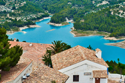 High angle view of buildings and trees in city