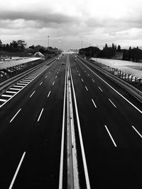 Highway road against cloudy sky