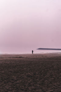 Scenic view of beach against sky during sunset