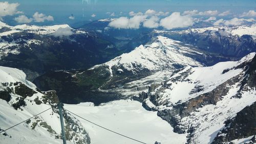 Scenic view of snow covered mountains